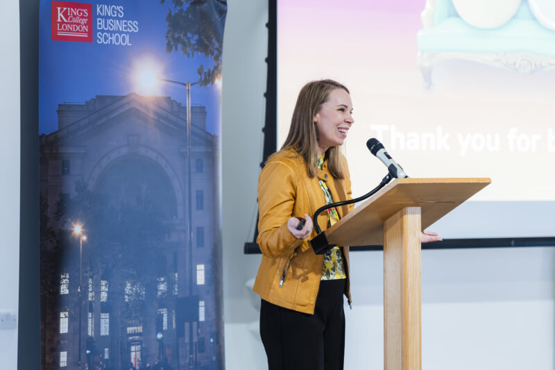 Woman speaking at King's Business School event.