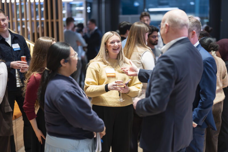 People socialising at professional networking event