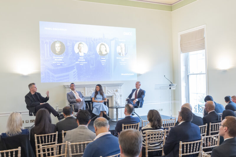 Four experts discuss business strategies at panel event.